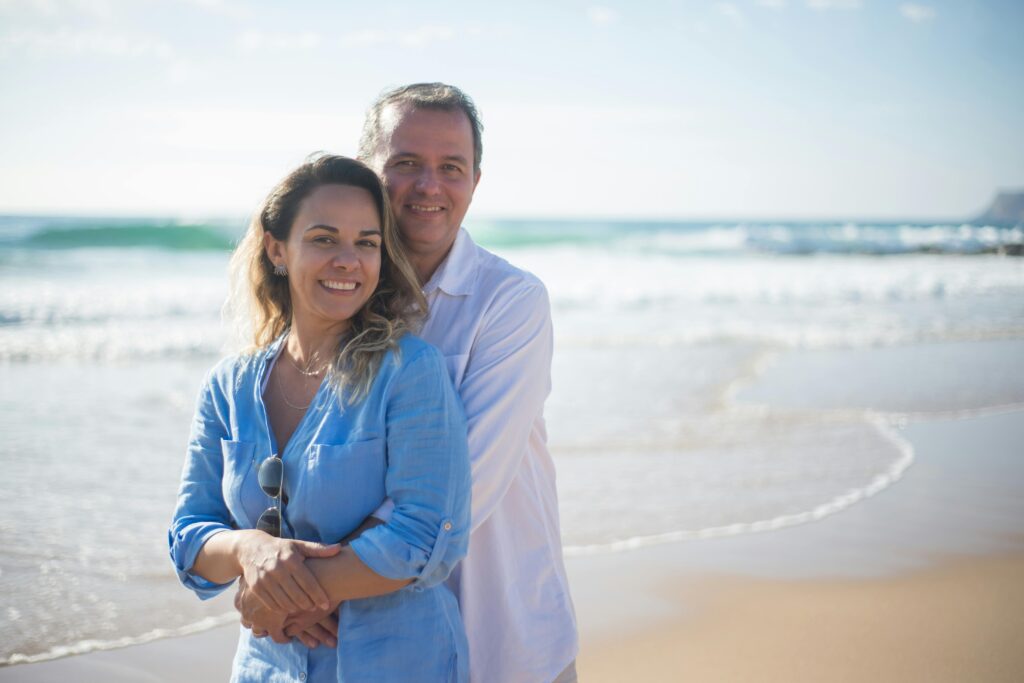 Happy couple walking on beach after IVF success in Antalya